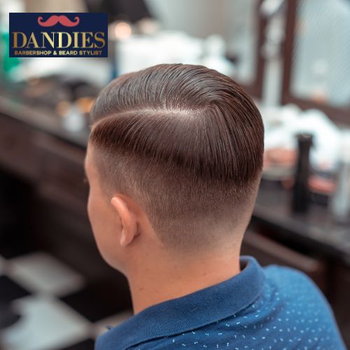 Mid skin fade with comb-over styling and natural volume, Dandies Barber Campbell.