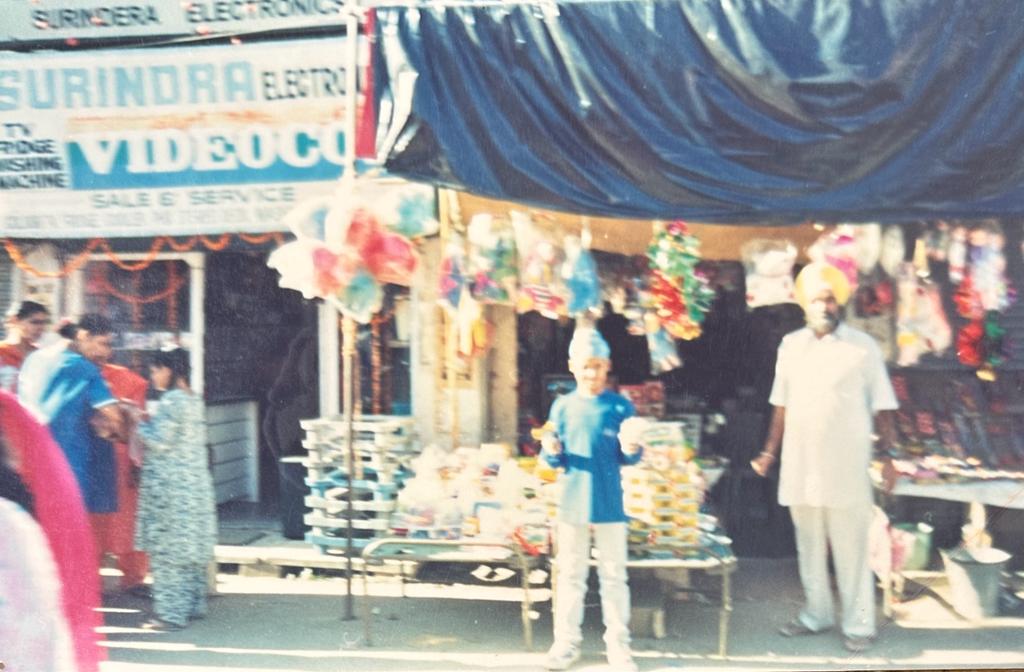 Family Shop in Punjab India, 10-year old Singh in the center