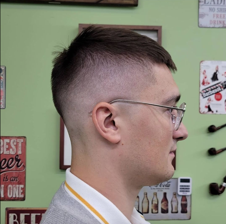 Low taper fade with soft blend and neat side profile, Campbell barber services.