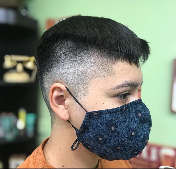Mid fade haircut with cropped top and sharp taper, professional barber in Campbell.