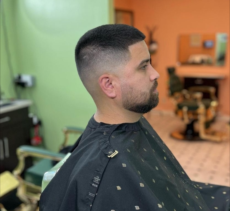 Skin fade with scissor-cut top for a balanced shape, clean modern haircut in Campbell.